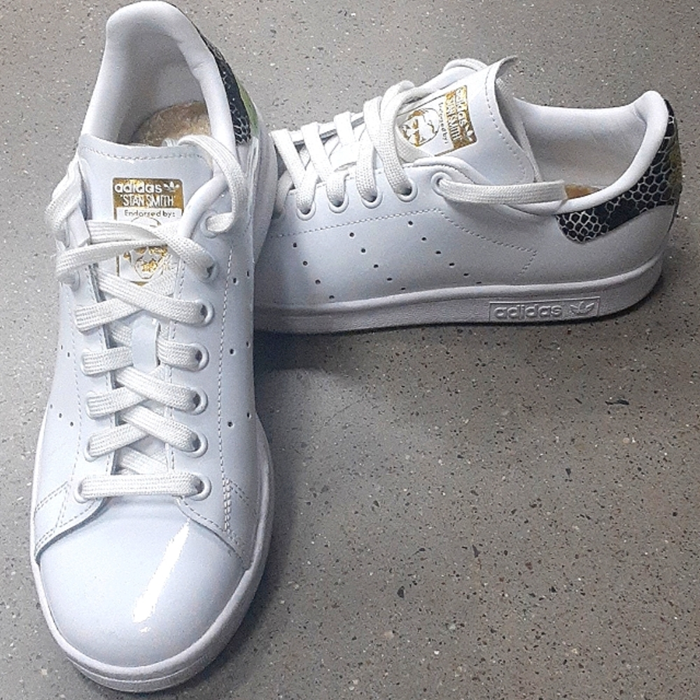 Size 7 shiny white Adidas w/black and gold accents